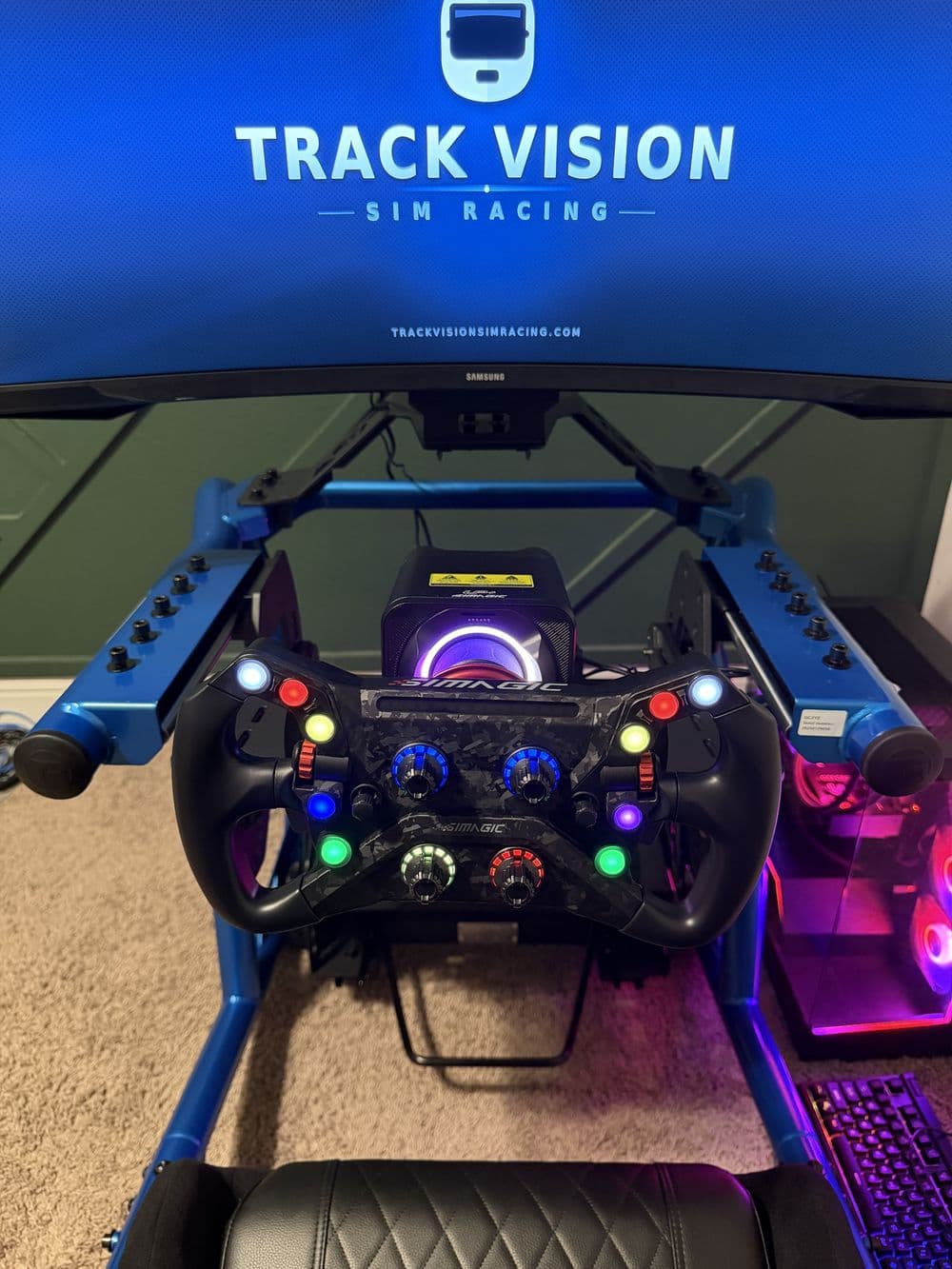 Tubular sim rig cockpit with a formula wheel