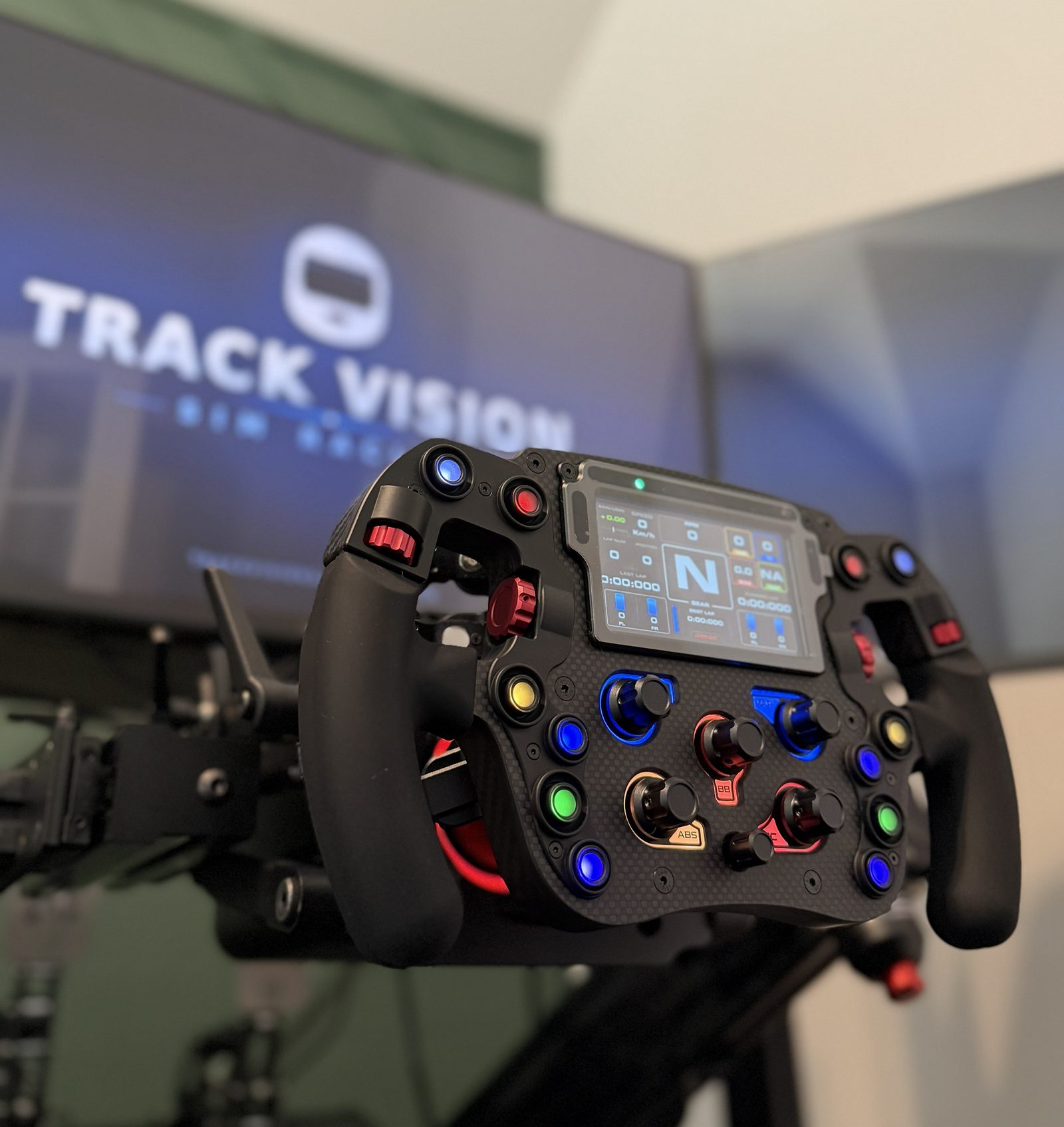 Formula-style sim racing wheel with display and colored buttons